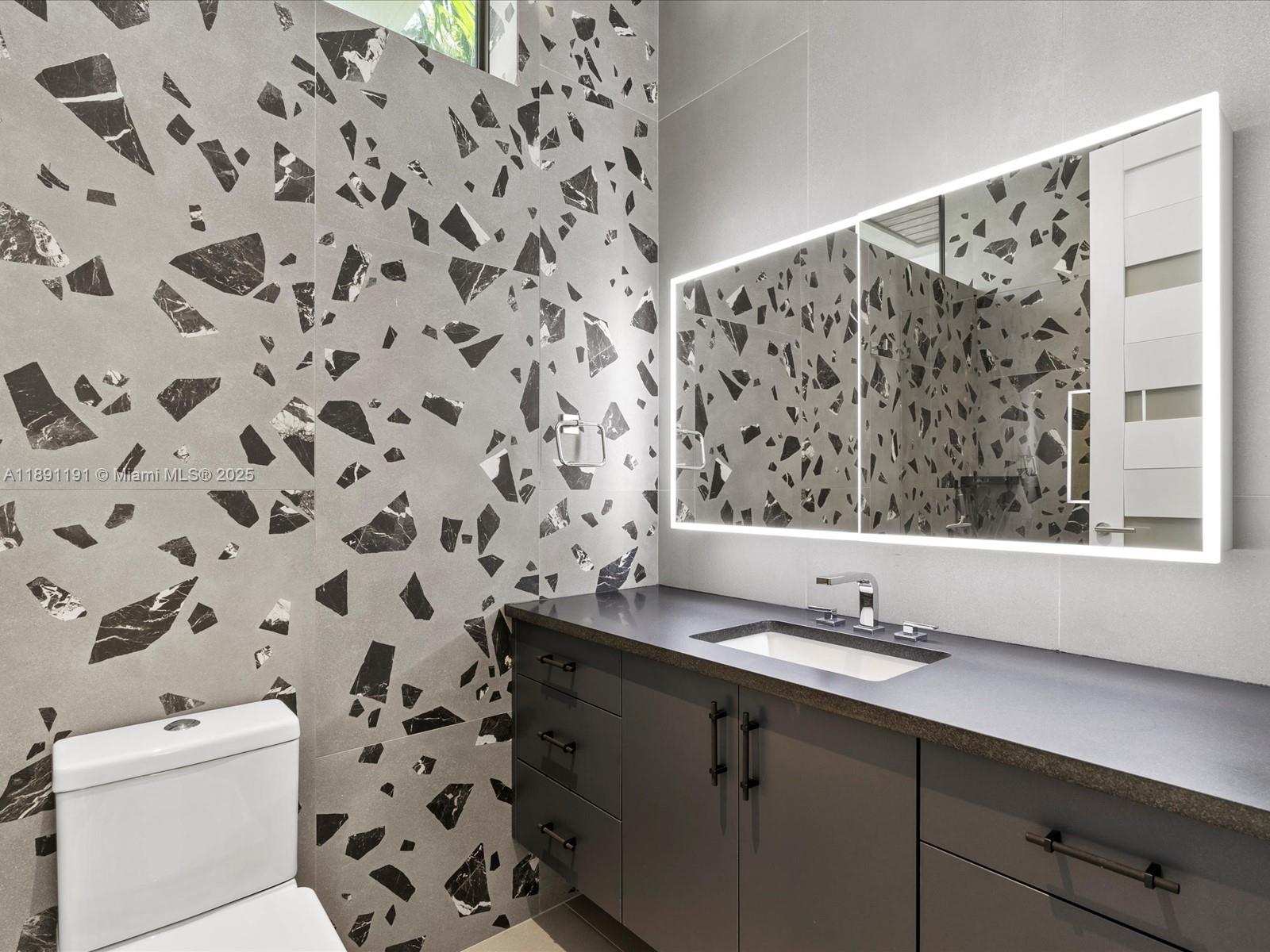 1736 Southeast 14th Street Fort Lauderdale, FL 33316 - Photo 45 of 54 a bathroom with a sink and a mirror