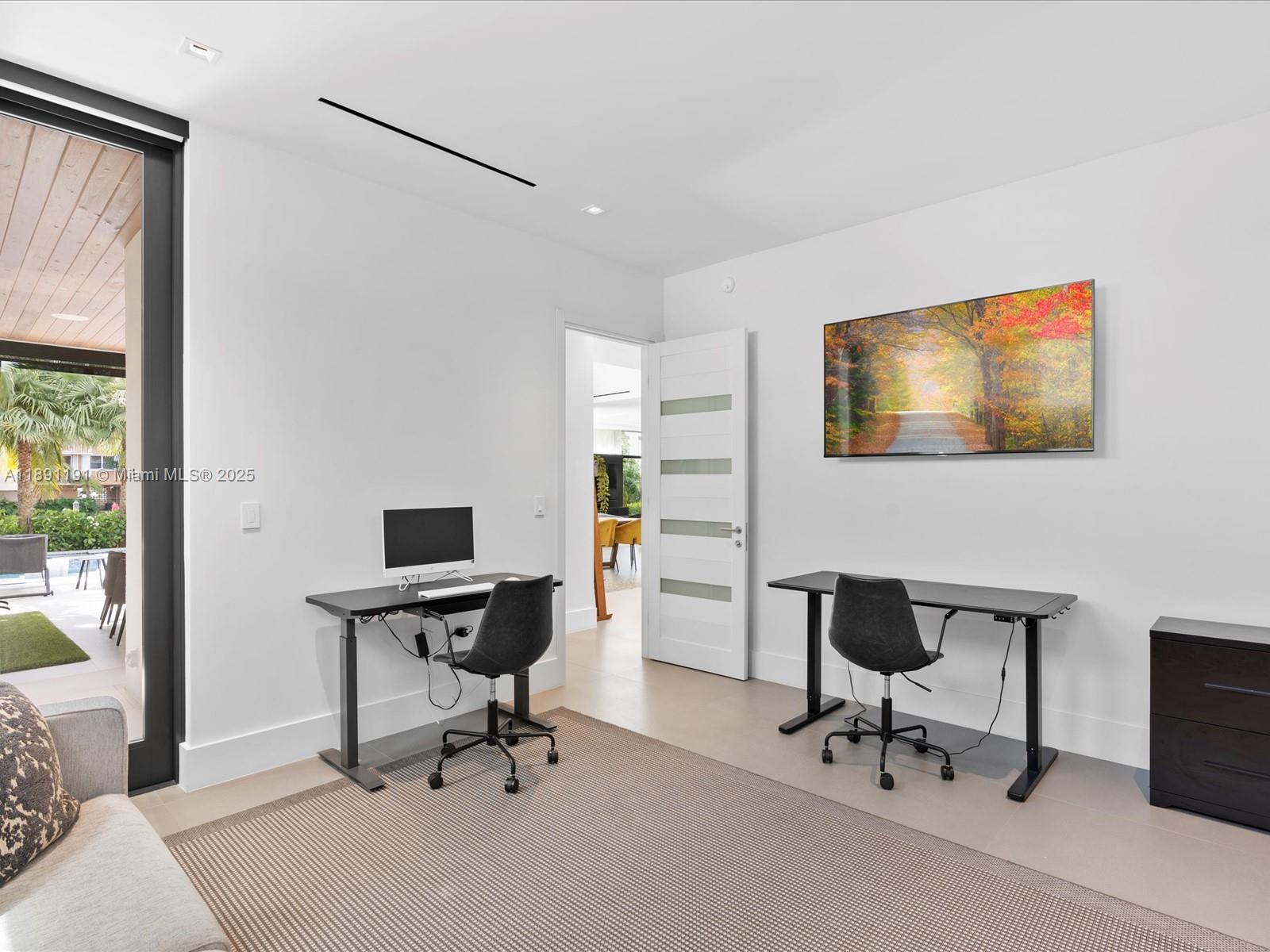 1736 Southeast 14th Street Fort Lauderdale, FL 33316 - Photo 46 of 54 a view of a workspace with furniture and a window