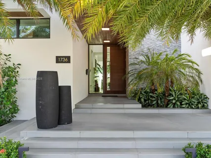 a view of potted plants in front of door