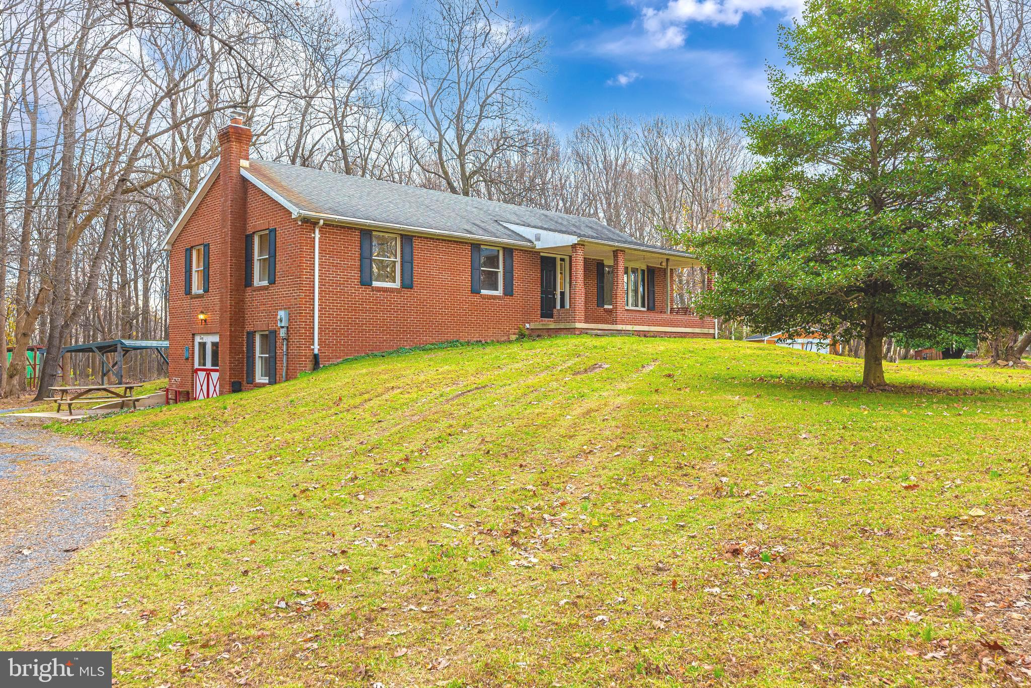 8009 Edgewood Church Road Frederick, MD 21702 - Photo 2 of 42 a front view of house with yard and trees
