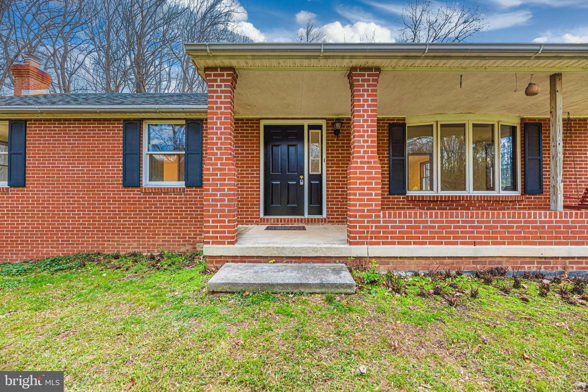 8009 Edgewood Church Road Frederick, MD 21702 - Photo 24 of 42 a front view of a house with a yard