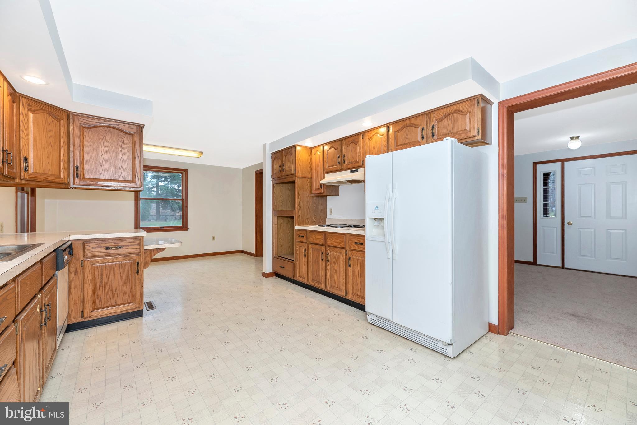8009 Edgewood Church Road Frederick, MD 21702 - Photo 33 of 42 a view of kitchen with furniture and refrigerator