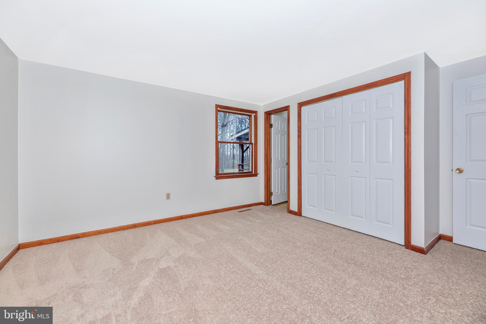 8009 Edgewood Church Road Frederick, MD 21702 - Photo 34 of 42 an empty room with windows and closet