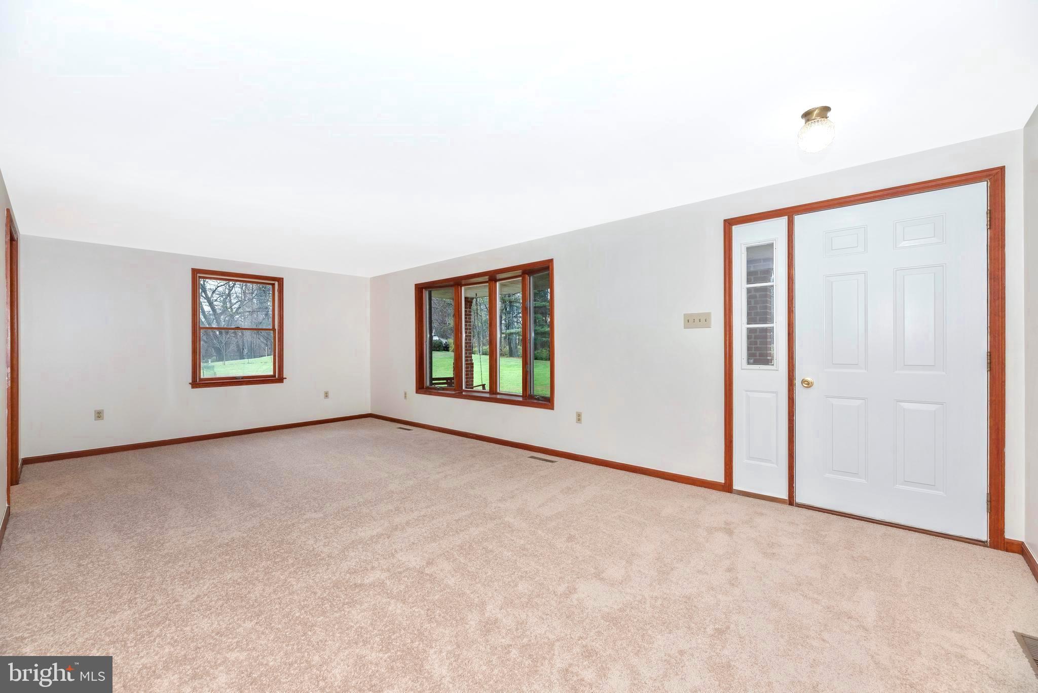 8009 Edgewood Church Road Frederick, MD 21702 - Photo 6 of 42 an empty room with windows and cabinet
