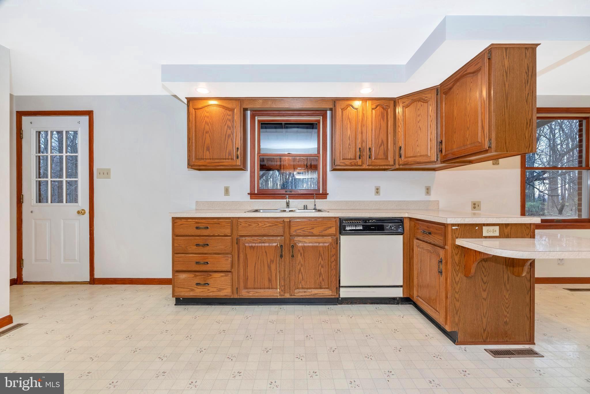 8009 Edgewood Church Road Frederick, MD 21702 - Photo 10 of 42 a kitchen with stainless steel appliances granite countertop a sink and cabinets