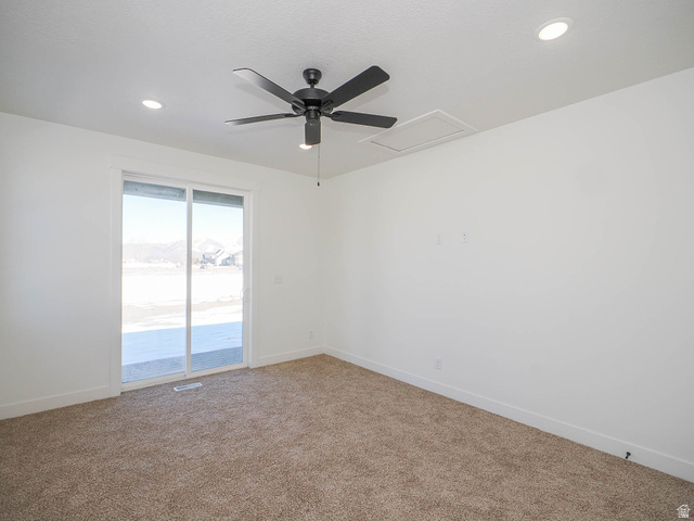 3938 North Wood Road Eagle Mountain, UT 84005 - Photo 19 of 55 Unfurnished room with ceiling fan, carpet flooring, and recessed lighting