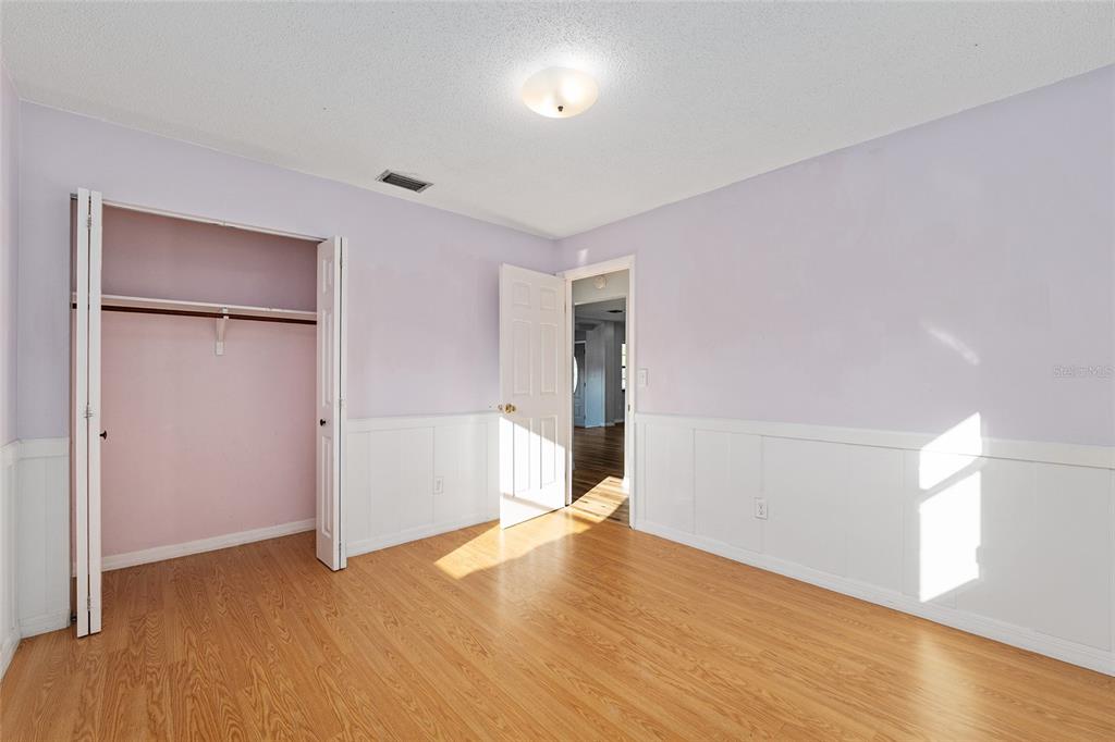 10577 Southeast 101st Avenue Road Belleview, FL 34420 - Photo 15 of 17 a view of empty room with wooden floor