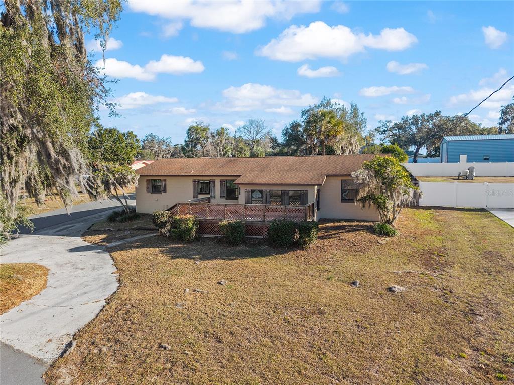 10577 Southeast 101st Avenue Road Belleview, FL 34420 - Photo 3 of 17 a front view of a house with a yard covered in snow
