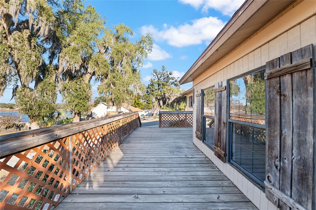 10577 Southeast 101st Avenue Road Belleview, FL 34420 - Photo 6 of 17 a view of balcony with wooden floor
