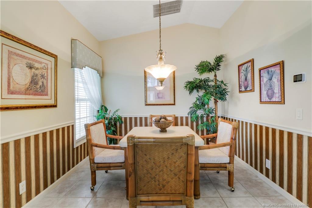 2698 Southwest Versailles Terrace Stuart, FL 34997 - Photo 12 of 29 a dining room with furniture and window