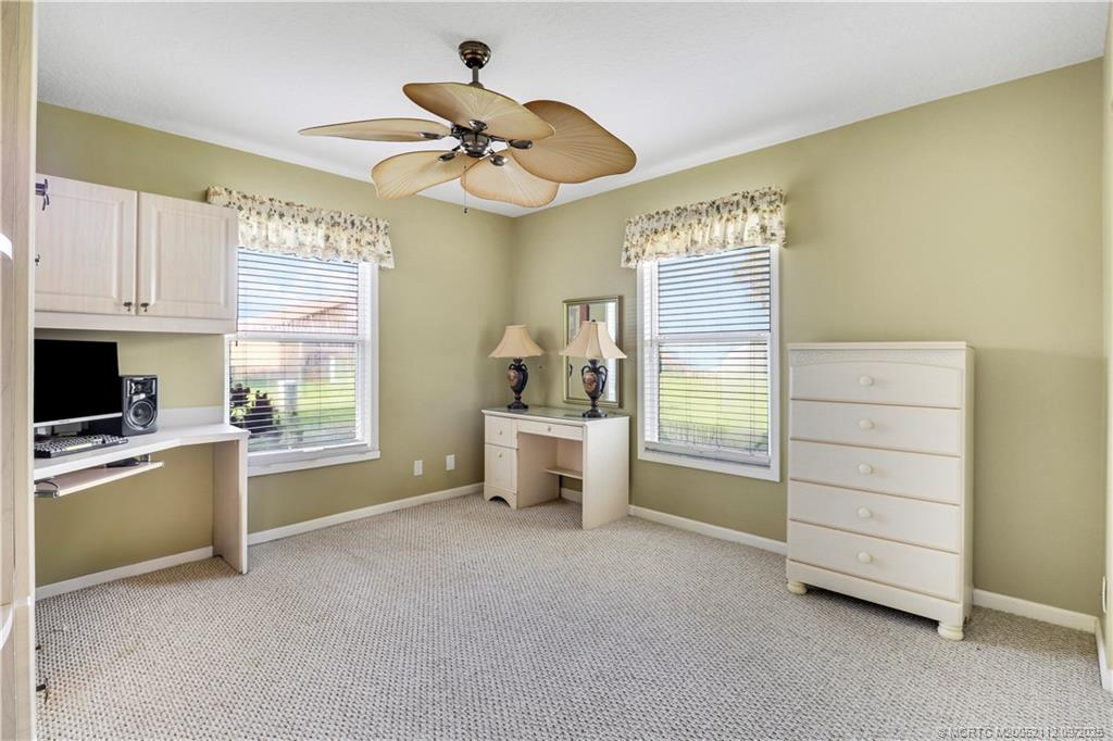 2698 Southwest Versailles Terrace Stuart, FL 34997 - Photo 22 of 29 a workspace with furniture and a window
