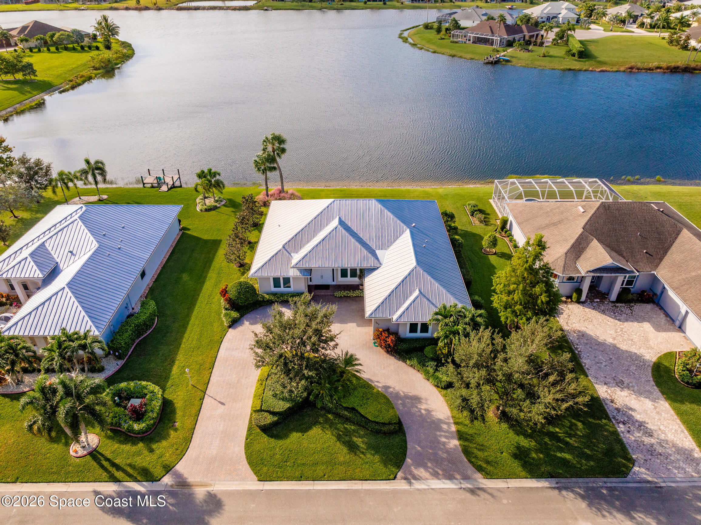 an aerial view of a house with a swimming pool