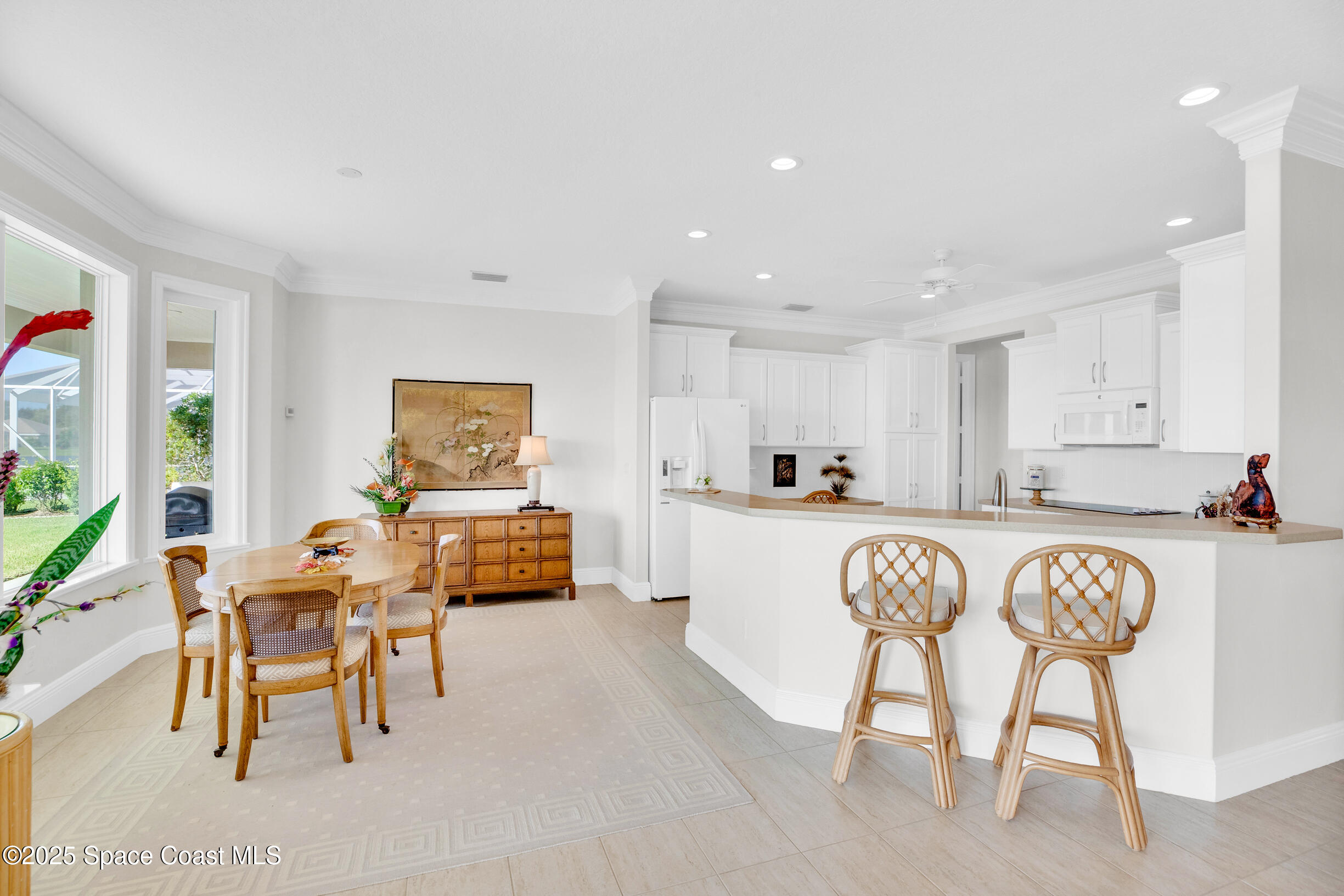 307 Yearling Trail Sebastian, FL 32958 - Photo 12 of 40 a kitchen with stainless steel appliances granite countertop furniture and a dining table