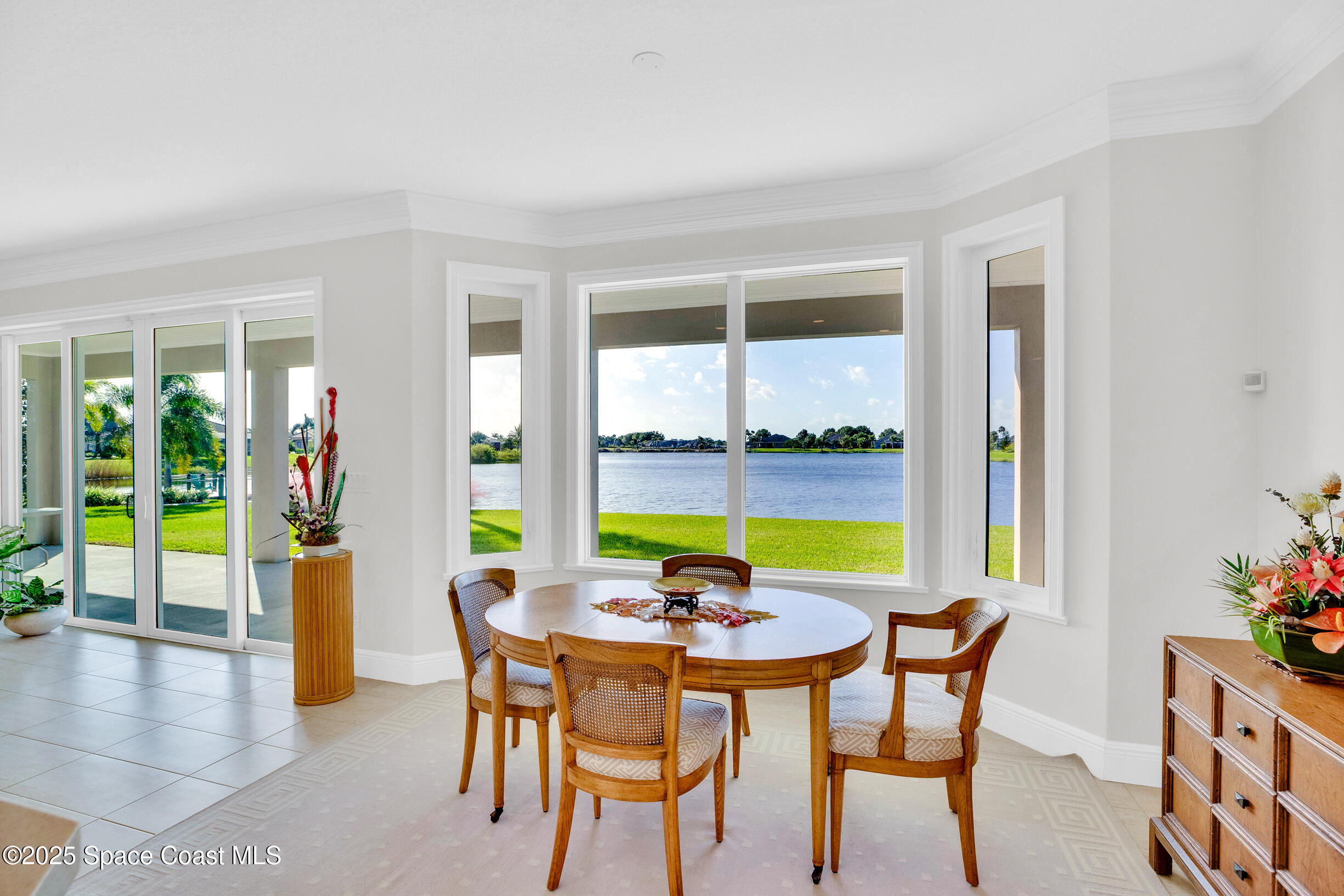 307 Yearling Trail Sebastian, FL 32958 - Photo 14 of 40 a view of a dining room with furniture window and wooden floor