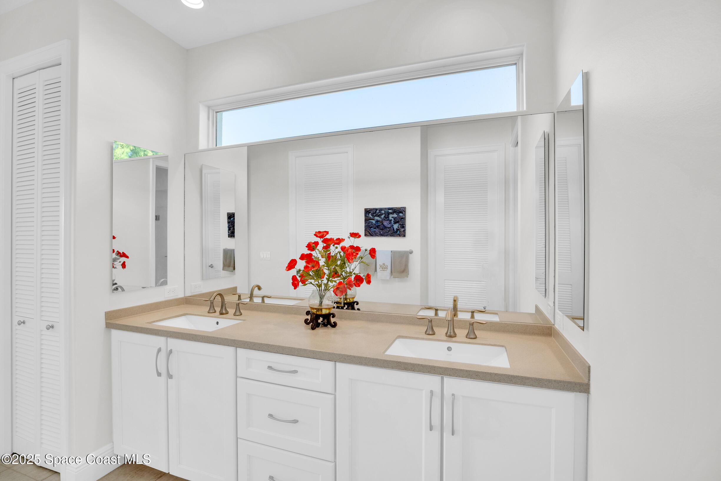 307 Yearling Trail Sebastian, FL 32958 - Photo 24 of 40 a bathroom with a sink and a mirror