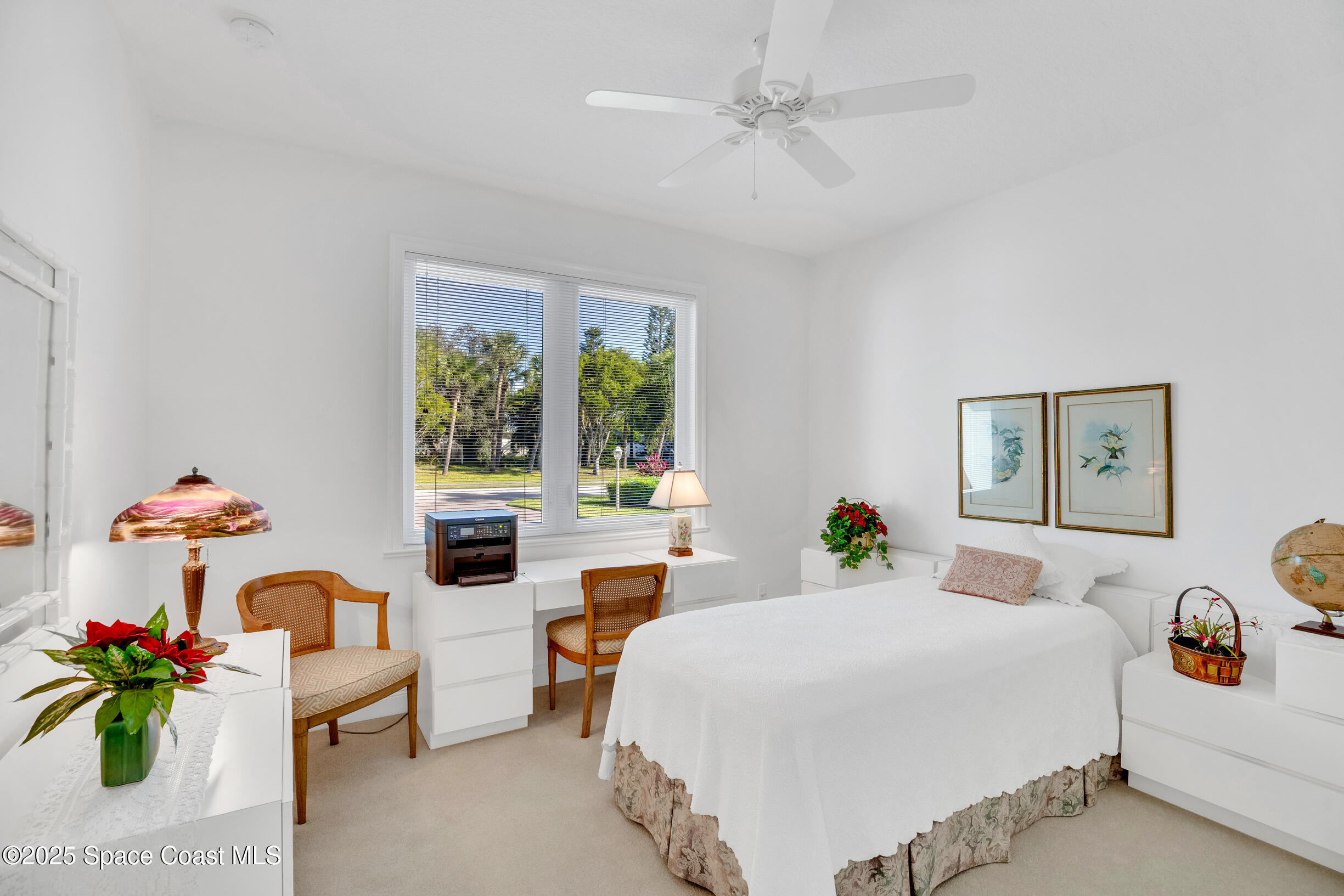 307 Yearling Trail Sebastian, FL 32958 - Photo 26 of 40 a bedroom with a bed mirror and window