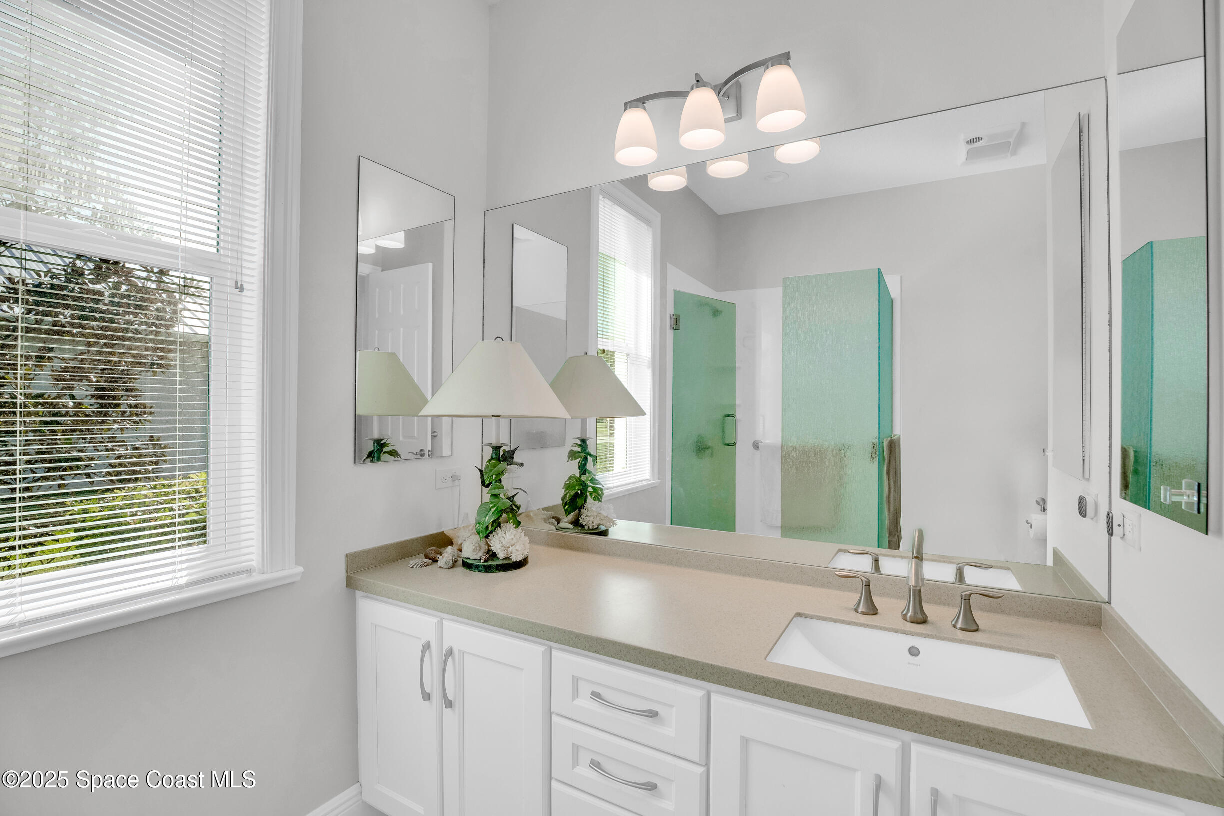 307 Yearling Trail Sebastian, FL 32958 - Photo 28 of 40 a bathroom with a double vanity sink and a mirror