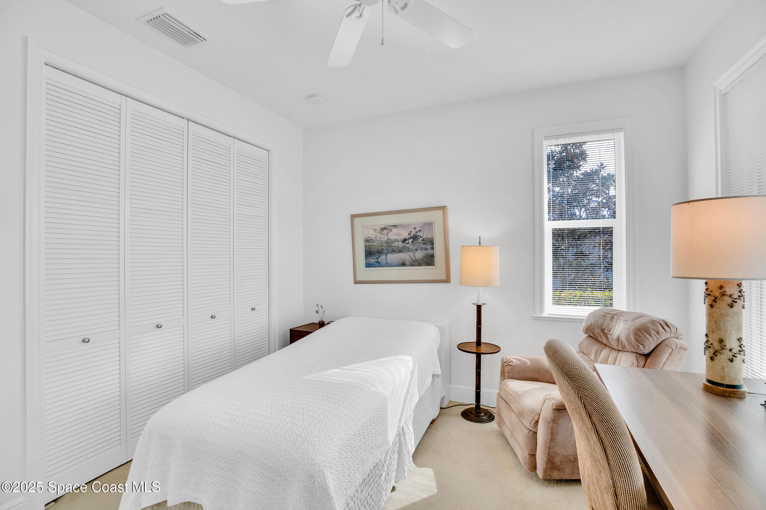 307 Yearling Trail Sebastian, FL 32958 - Photo 30 of 40 a bedroom with two beds and a table