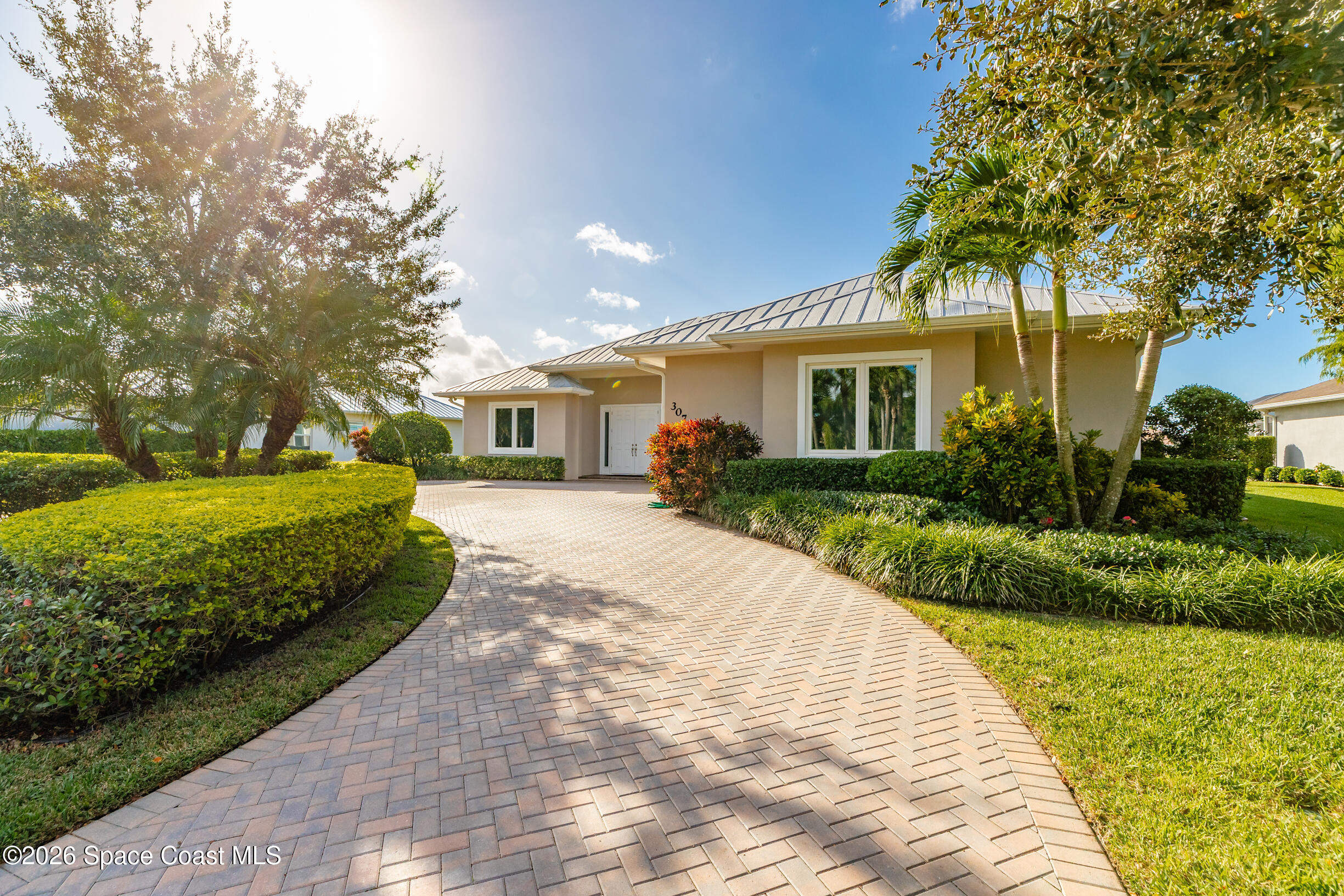 307 Yearling Trail Sebastian, FL 32958 - Photo 3 of 40 a front view of a house with a yard