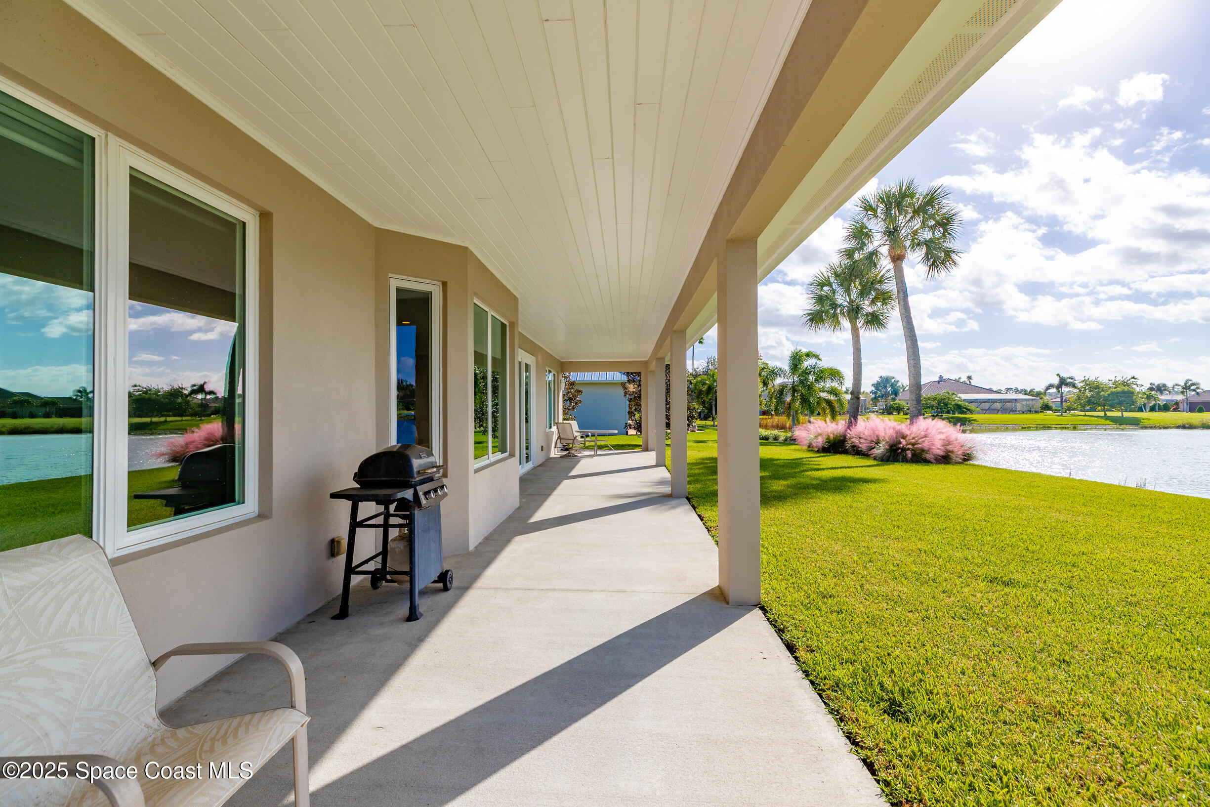 307 Yearling Trail Sebastian, FL 32958 - Photo 33 of 40 a view of a patio with swimming pool table and chairs