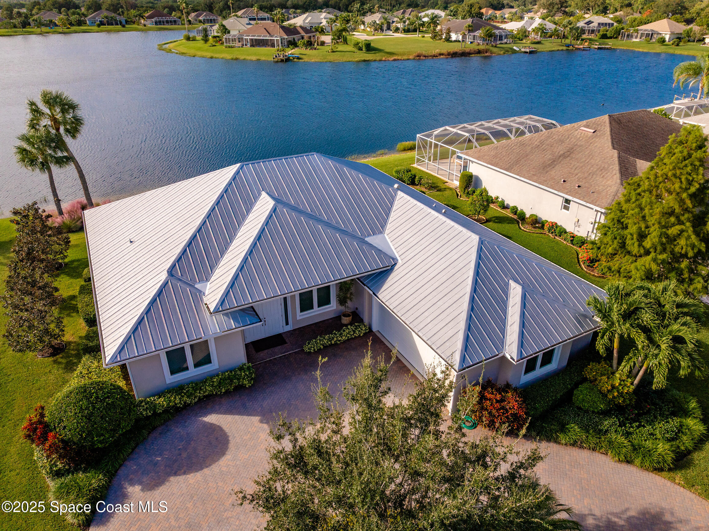 307 Yearling Trail Sebastian, FL 32958 - Photo 6 of 40 an aerial view of a house with a yard and lake view