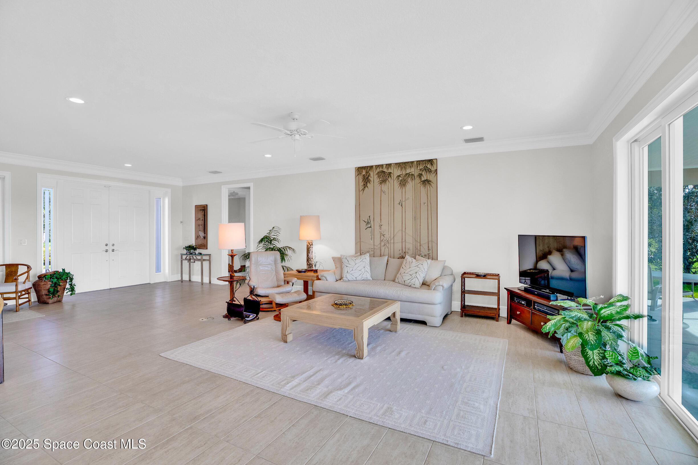 307 Yearling Trail Sebastian, FL 32958 - Photo 10 of 40 a living room with furniture and a flat screen tv