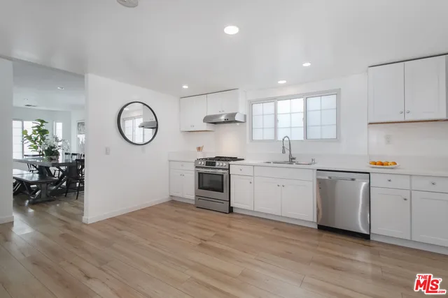 a view of kitchen with wooden floor