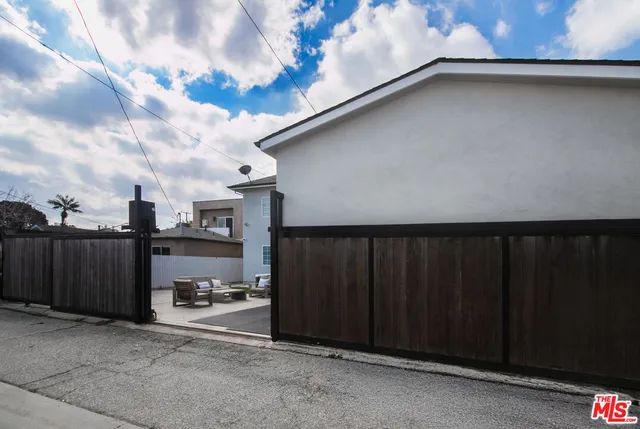 a living room with furniture a rug and a projector