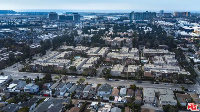 an aerial view of a house with a swimming pool