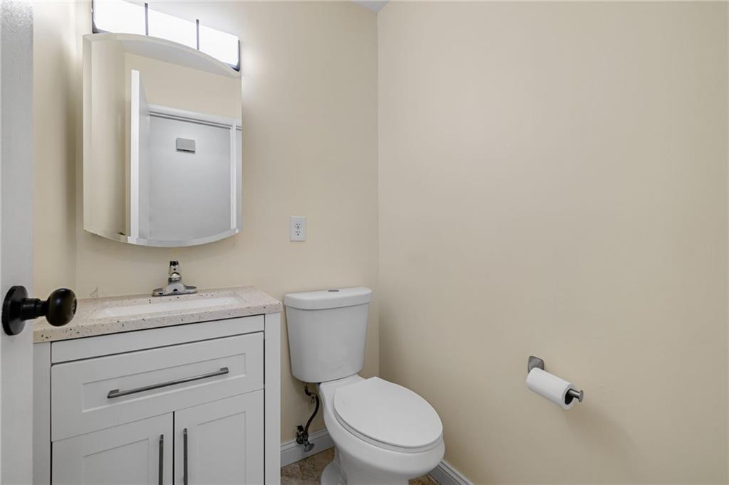 105 Springwater Court Coraopolis, PA 15108 - Photo 12 of 31 a bathroom with a toilet a sink and mirror