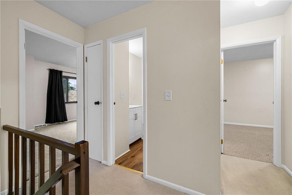 105 Springwater Court Coraopolis, PA 15108 - Photo 16 of 31 a view of a hallway with wooden floor and staircase