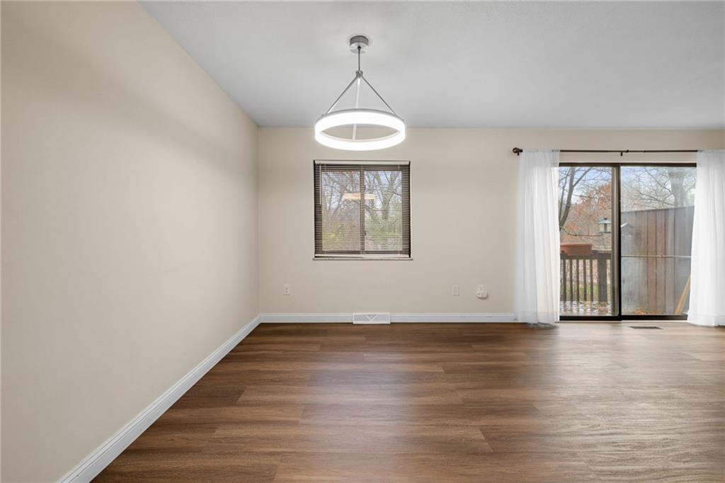 105 Springwater Court Coraopolis, PA 15108 - Photo 9 of 31 a view of a room with wooden floor and large windows