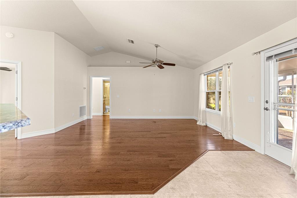 4401 Southwest 62nd Loop Ocala, FL 34474 - Photo 18 of 53 an empty room with wooden floor and windows