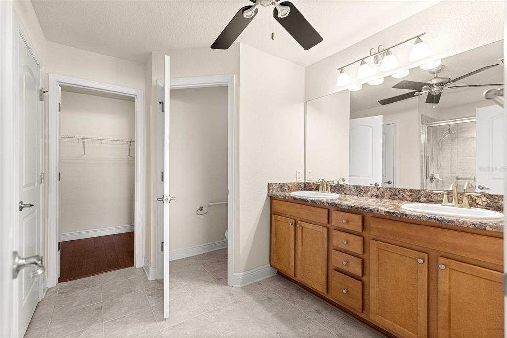 4401 Southwest 62nd Loop Ocala, FL 34474 - Photo 24 of 53 a bathroom with a double vanity sink and mirror