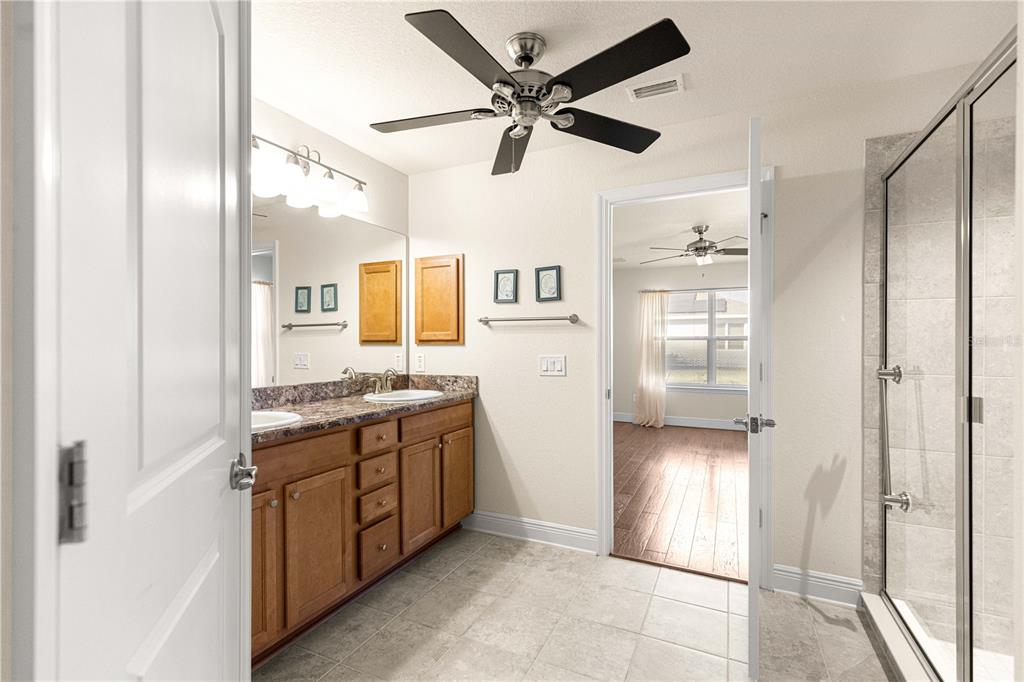 4401 Southwest 62nd Loop Ocala, FL 34474 - Photo 25 of 53 a view of a kitchen with a sink and dishwasher a refrigerator with wooden floor