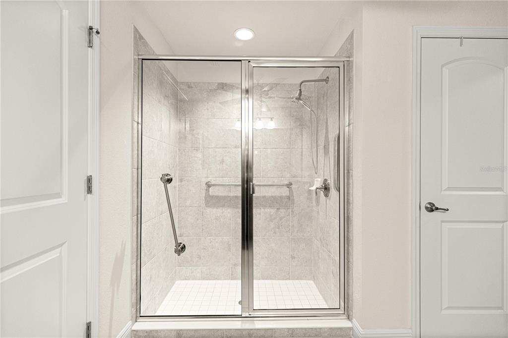 4401 Southwest 62nd Loop Ocala, FL 34474 - Photo 26 of 53 a bathroom with a glass shower door