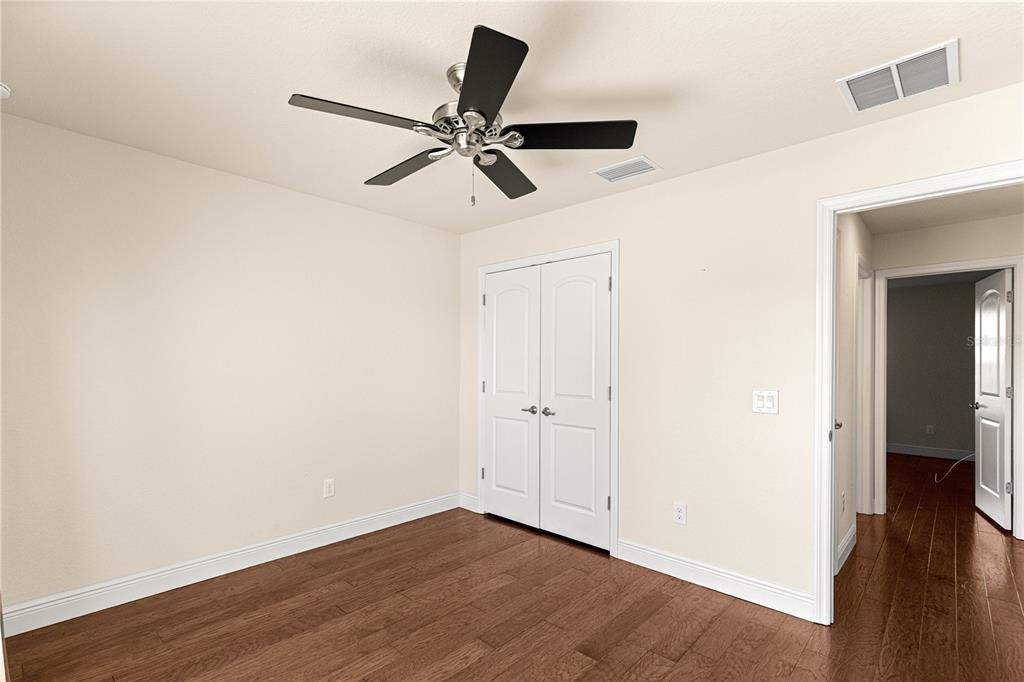 4401 Southwest 62nd Loop Ocala, FL 34474 - Photo 28 of 53 wooden floor in an empty room