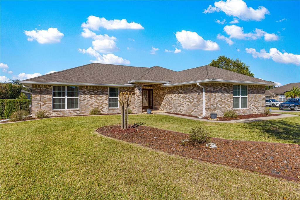 4401 Southwest 62nd Loop Ocala, FL 34474 - Photo 39 of 53 a front view of a house with garden