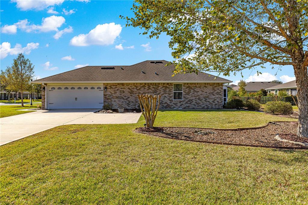 4401 Southwest 62nd Loop Ocala, FL 34474 - Photo 41 of 53 a view of a house with a yard