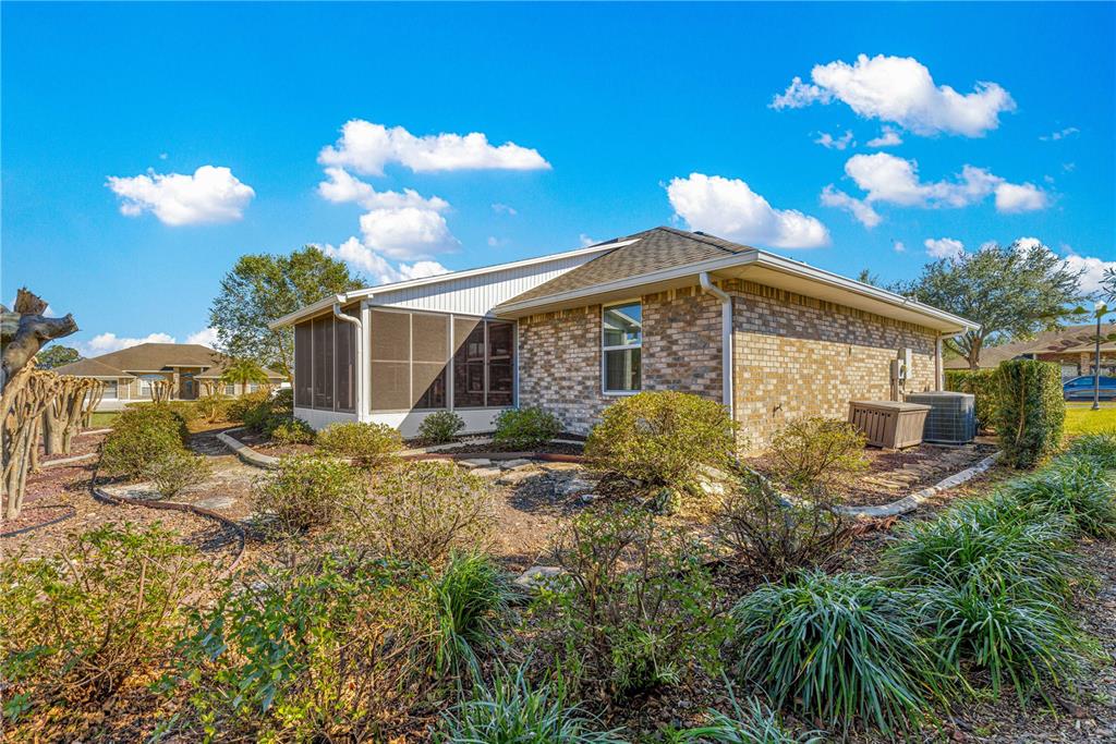 4401 Southwest 62nd Loop Ocala, FL 34474 - Photo 43 of 53 a view of a house with a yard