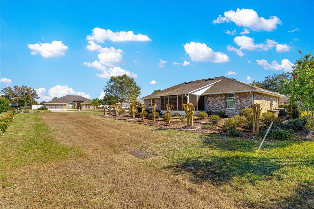 4401 Southwest 62nd Loop Ocala, FL 34474 - Photo 44 of 53 a front view of house with garden and patio