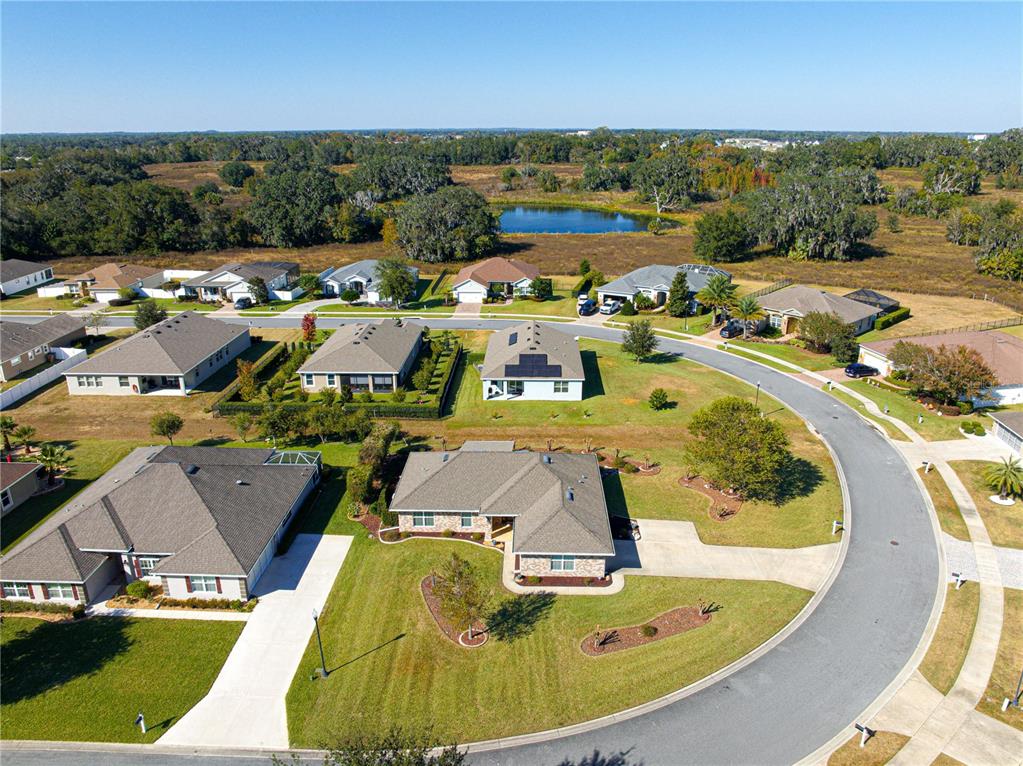 4401 Southwest 62nd Loop Ocala, FL 34474 - Photo 49 of 53 an aerial view of a swimming pool with outdoor seating and yard