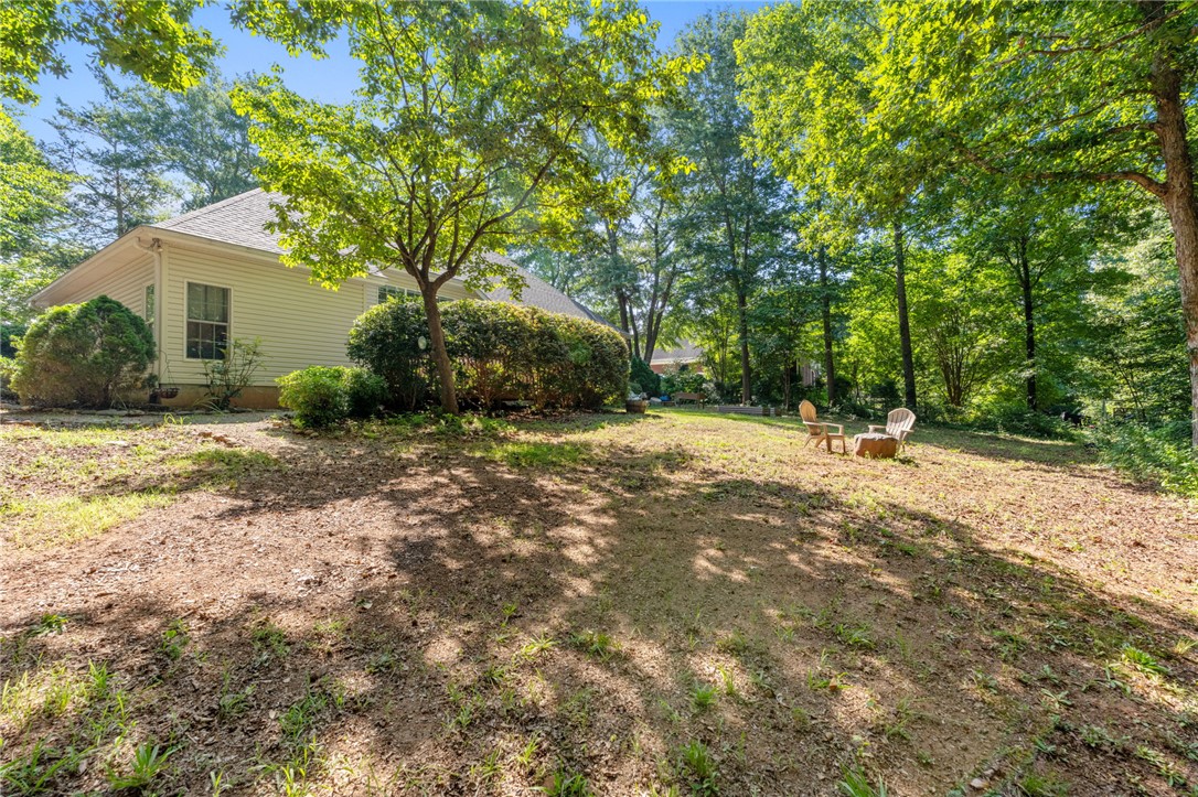 108 Winterbrook Circle Seneca, SC 29678 - Photo 34 of 40 A spacious yard with mature trees and a tranquil setting, perfect for outdoor relaxation.