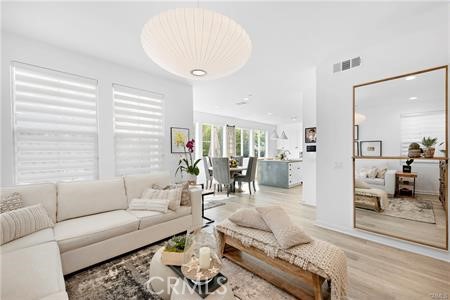 945 Sunlit Lane Costa Mesa, CA 92626 - Photo 11 of 31 a living room with furniture and a large window