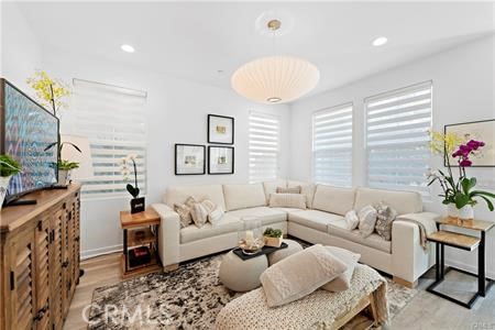 945 Sunlit Lane Costa Mesa, CA 92626 - Photo 12 of 31 a living room with furniture and a large window