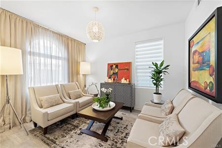 945 Sunlit Lane Costa Mesa, CA 92626 - Photo 15 of 31 a living room with furniture and a large window