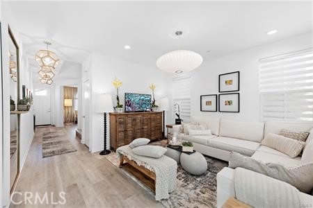 945 Sunlit Lane Costa Mesa, CA 92626 - Photo 16 of 31 a living room with furniture and a fireplace