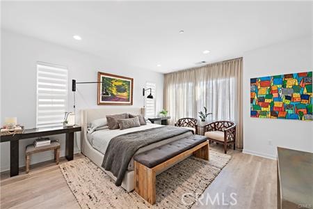 945 Sunlit Lane Costa Mesa, CA 92626 - Photo 18 of 31 a bed room with a bed and a couch