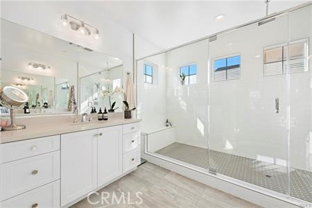945 Sunlit Lane Costa Mesa, CA 92626 - Photo 20 of 31 a spacious bathroom with double sink and shower