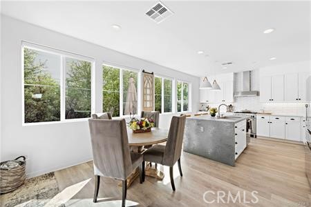 945 Sunlit Lane Costa Mesa, CA 92626 - Photo 8 of 31 a dining room with furniture window wooden floor
